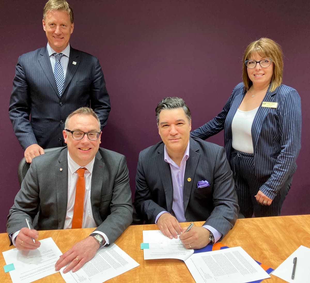 Athabasca University President Dr. Alex Clark and Aspen View Public Schools Superintendent Constantine Kastrinos sign a five-year partnership agreement between the two organizations.
