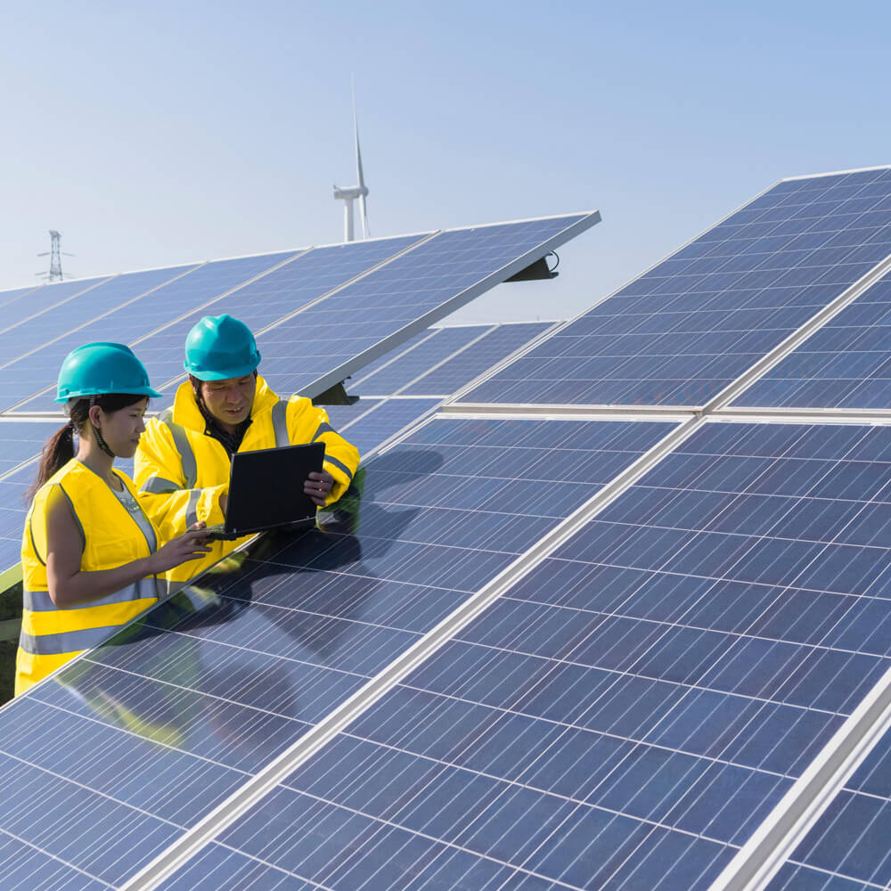 Workers working with solar panels