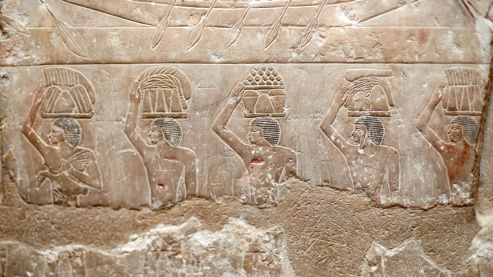 Procession of men carrying food offerings on their heads to the deceased owner of a V Dynasty mastaba - Idut. Saqqara, Egypt